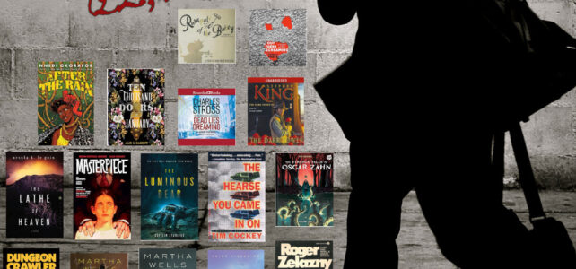 Man walking by a display of book covers